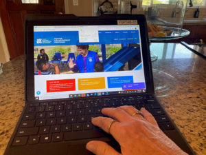 Photo of laptop viewing the Foster Grandparent Program web page