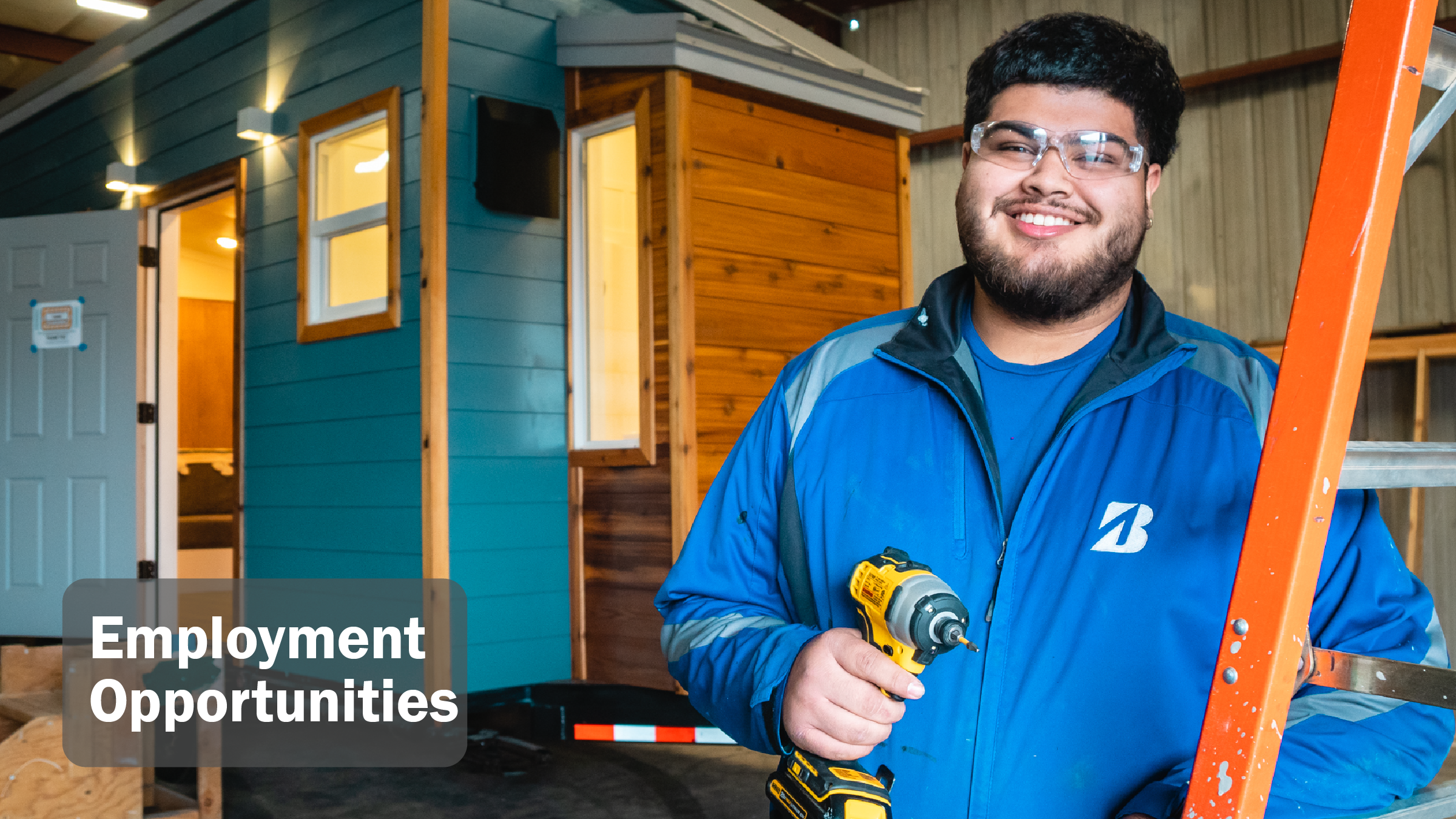 image of a person holding power tools with a tiny home construction in the background. titled employment opportunities
