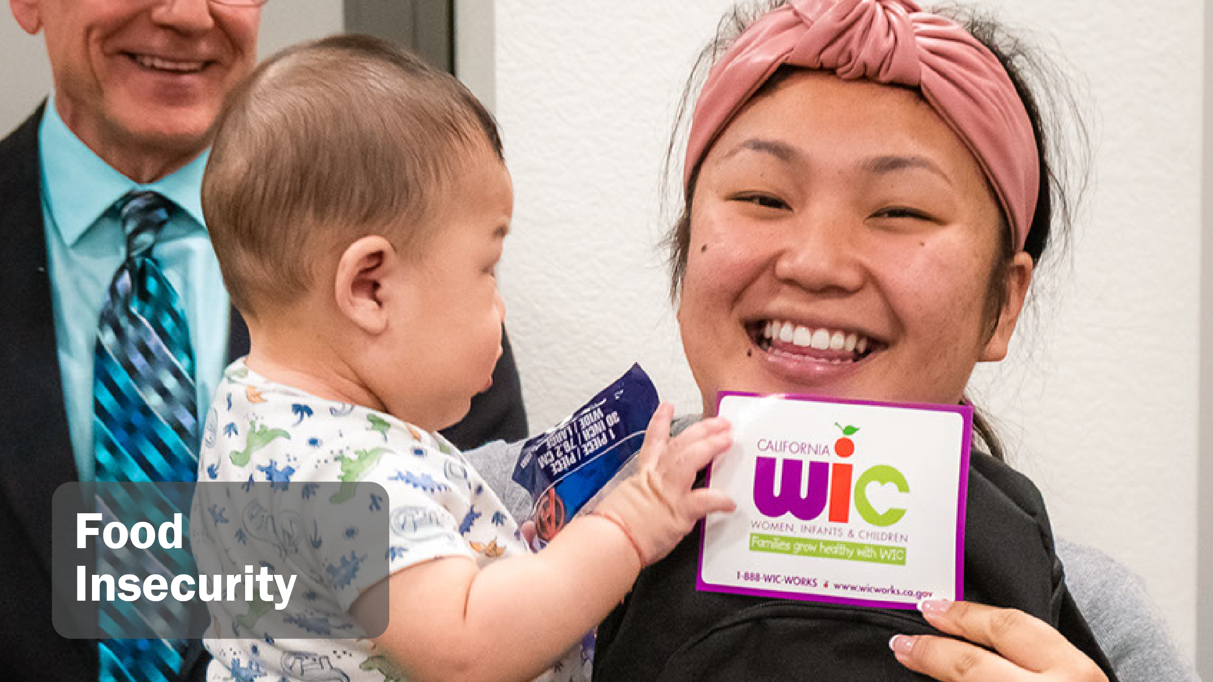 image with mom and baby holding up a WIC sticker titled food insecurity